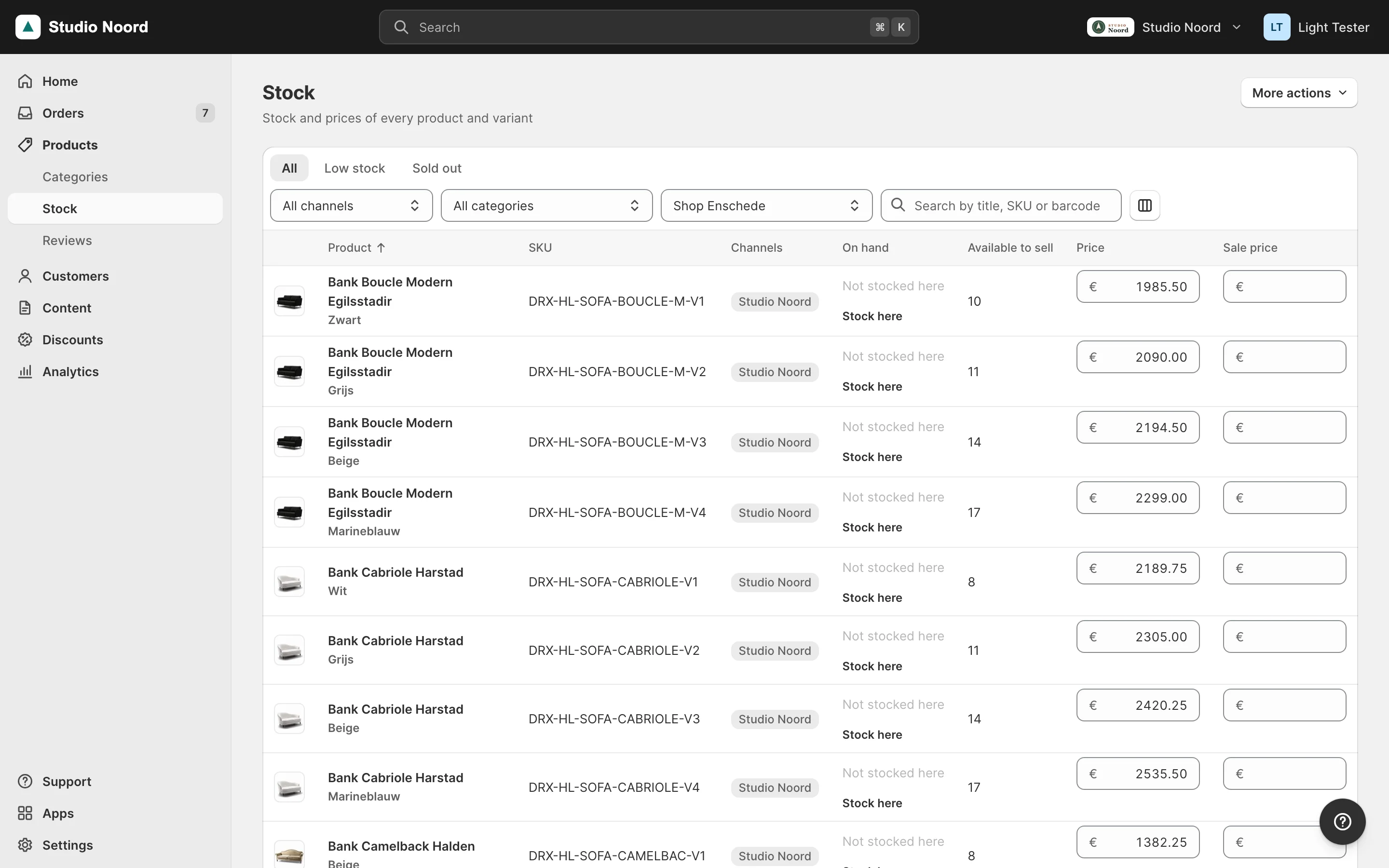 The Stock page filtered on Shop Enschede: products not stocked there show Not stocked here with Stock here